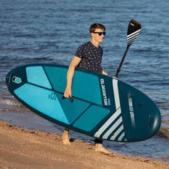 Gladiator Pro 10'6 X 32" Paddleboard 2023 -UK Surf Sales 2024 gladiator 10 6 on beach male model 2
