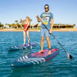 Gladiator Pro 11'4 X 32" Paddleboard 2023 -UK Surf Sales 2024 gladiator 11 4 12 6 pro s man on sea with11 2 in back 1