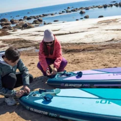 Gladiator Pro 10'6 X 32" Paddleboard 2023 -UK Surf Sales 2024 sq winter 10 6 11 2 putting leash on